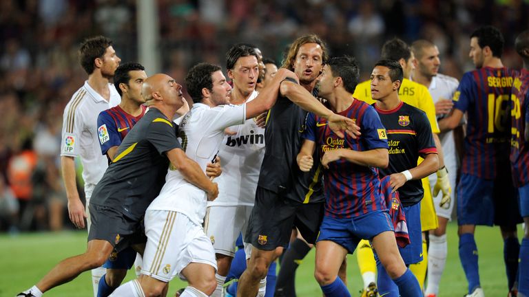 Barcelona's players argue with Real Madrid's players during the second leg of the Spanish Supercup football match FC Barcelona vs Real Madrid CF on August 