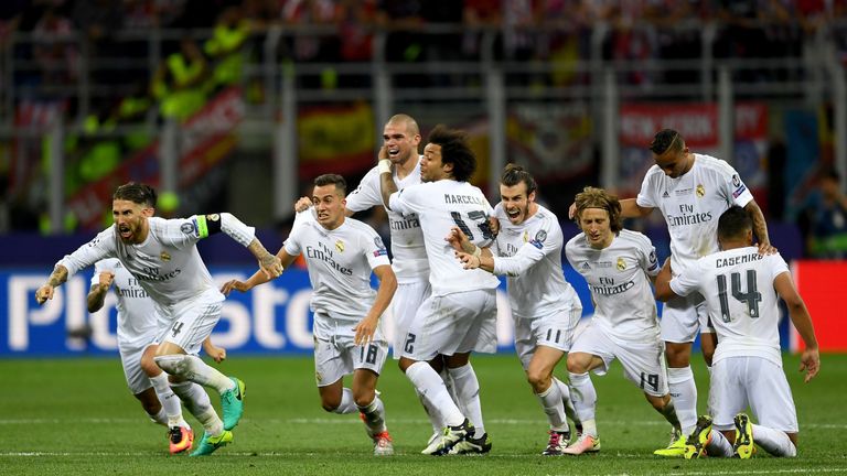 Real Madrid players celebrate Cristiano Ronaldo scores the winning penalty in the Champions League final