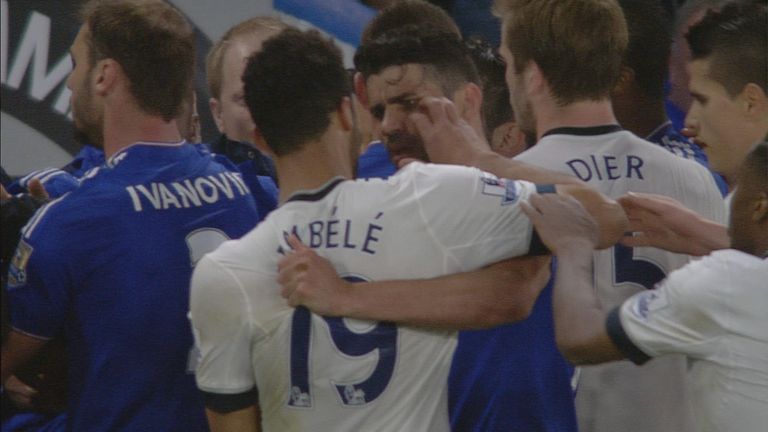 Moussa Dembele appears to reach towards Diego Costa's eye during a mass brawl involving both teams