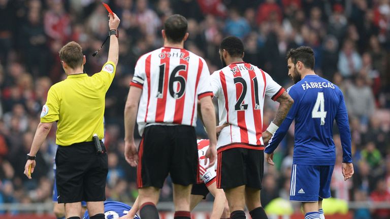 Chelsea's John Terry is shown a red card by referee Mike Jones after fouling Sunderland's Wahbi Khazri