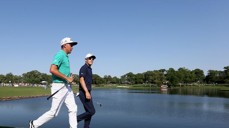 CHARLOTTE, NC - MAY 07:  (L-R) Rickie Fowler and Scott Langley walk to the 17th hole during the third round of the 2016 Wells Fargo Championship at Quail H