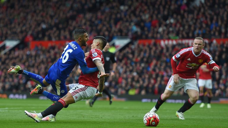Marcos Rojo of Manchester United challenges Riyad Mahrez of Leicester City