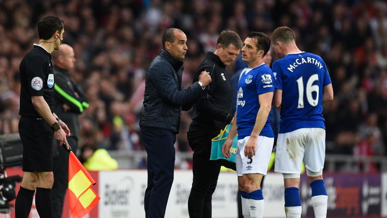 Roberto Martinez, manager of Everton talks to Leighton Baines