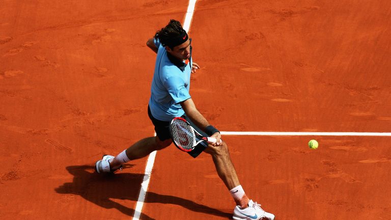 PARIS - JUNE 01:  Roger Federer of Switzerland hits a forehand during the Men's Singles Fourth Round match against Tommy Haas of Germany on day nine of the