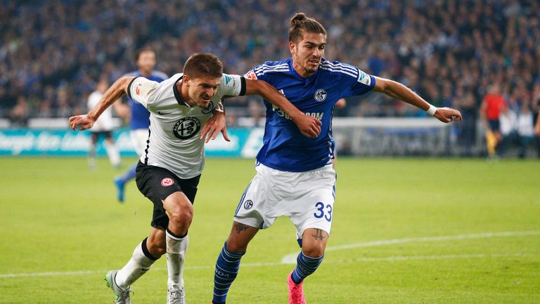 Aleksandar Ignjovski of Eintracht Frankfurt (left) battles for the ball with Roman Neustadter of FC Schalke 04 