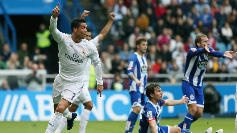 Real Madrid's Portuguese forward Cristiano Ronaldo (L) celebrates a goal during the Spanish league football match RC Deportivo de la Coruna vs Real Madrid 