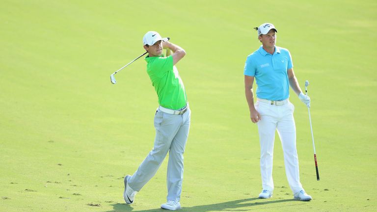 DUBAI, UNITED ARAB EMIRATES - NOVEMBER 19:  (L-R) Rory McIlroy of Northern Ireland and Danny Willett of England are pictured together on the 12th hole duri