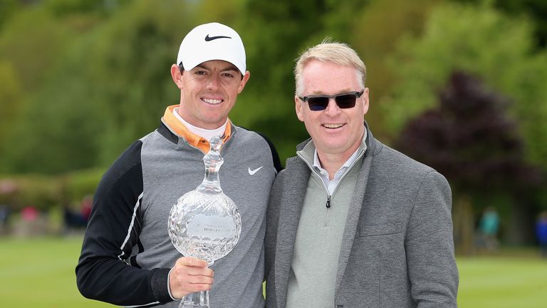 Rory McIlroy of Northern Ireland poses with the trophy with Keith Pelley, Chief Executive of The European Tour,