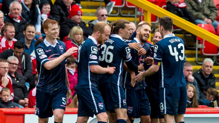 Ross County players celebrate after Martin Woods puts them 4-0 up at Aberdeen