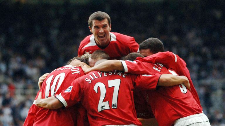  Manchester United's captaian Roy Keane dives over as the team celebrates Ruud van Nistelrooy's goal against Newcastle