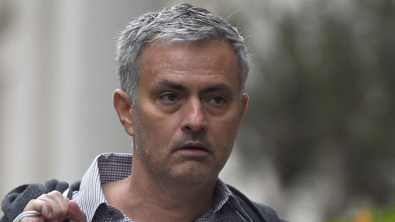 Former Chelsea manager Jose Mourinho walks towards his house in London