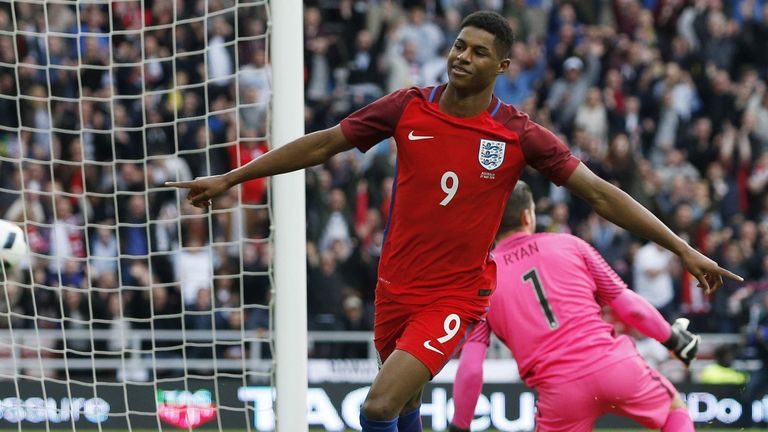 Marcus Rashford celebrates after scoring the first goal for England against Australia.