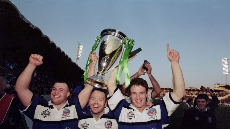 Bath rugby players Mark Regan, Ieuan Evans and Mike Catt celebrating their team's 19-18 victory over Brive in the 1998 Heineken Cup final