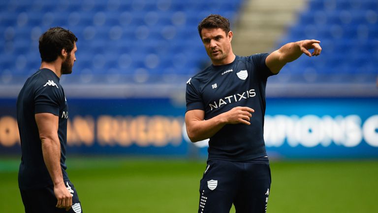 Dan Carter talks tactics with Maxime Machenaud during the captain's run ahead of the Champions Cup final