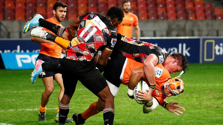 Tomas Lavanini of the Jaguares is tackled by Stefan Willemse of the Southern Kings