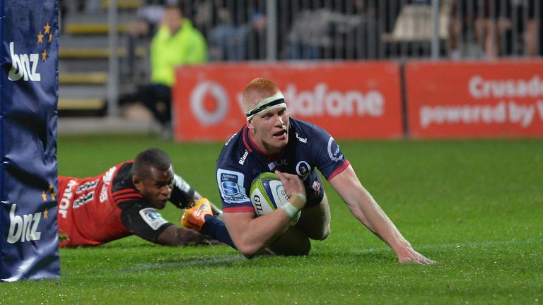 Campbell Magnay of the Reds dives over to score a try during the round 11 Super Rugby match between the Crusaders and the Reds at AMI Stadium