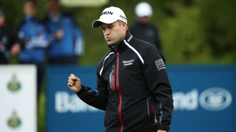 Russell Knox of Scotland celebrates a birdie putt on the 14th hole during the final round of the Dubai Duty Free Irish Open