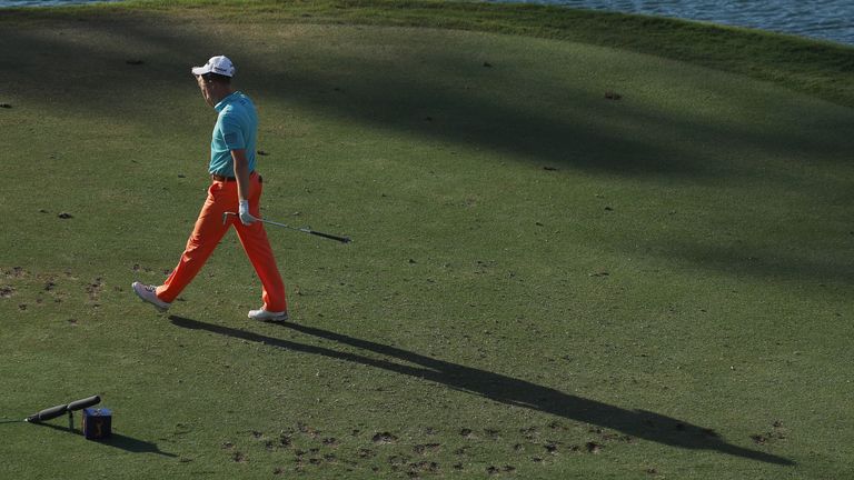 Russell Knox heads to the drop zone after knocking three balls in the water from the 17th tee