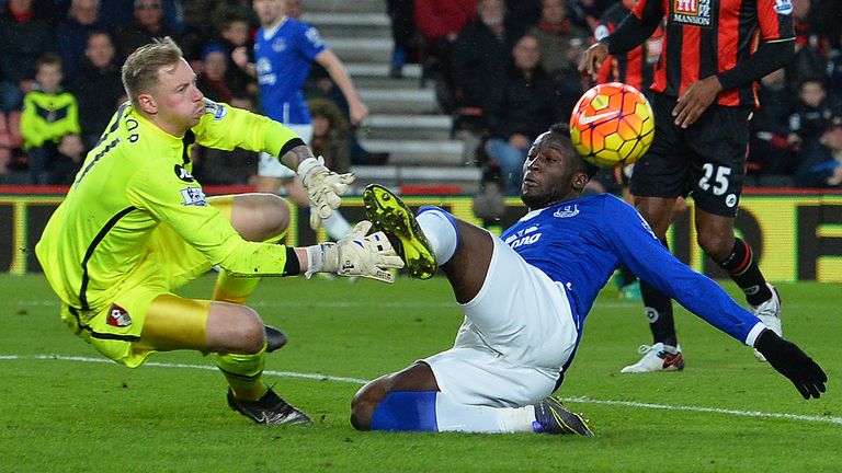 Bournemouth's English goalkeeper Ryan Allsop  dives to make a save against Everton