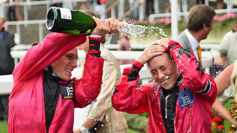 Sammy Jo Bell is sprayed with champagne by her captain Emma-Jayne Wilson
