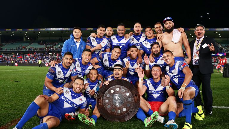 Samoa pose and celebrate with the Pacific Test trophy after the International Rugby League Test match between Tonga and Samoa