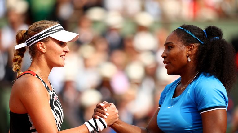 Serena Williams (R)  shakes hands with Kristina Mladenovic