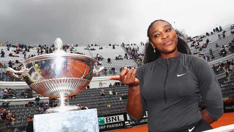 Serana Williams admires the trophy after winning the Italian Open