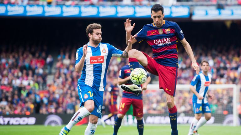 Sergio Busquets of FC Barcelona controls the ball next to Jose Alberto Canas of RCD Espanyol during the La Liga match between FC