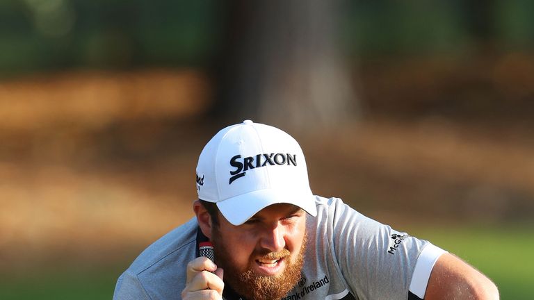 Shane Lowry of Ireland lines up a putt on the second green during the first round of THE PLAYERS Championship 