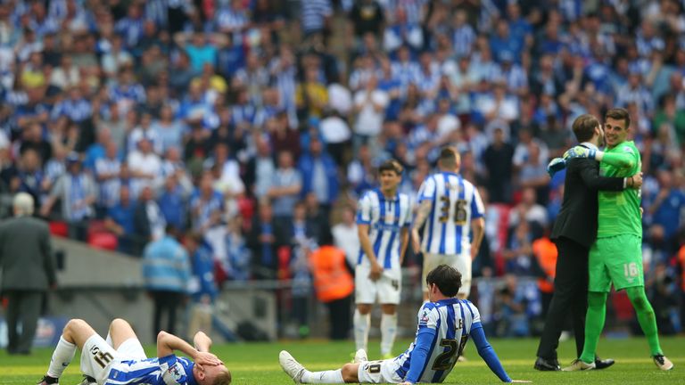 Dejected Sheffield Wednesday players are left on the pitch after the Sky Bet Championship Play Off Final match between Hull City