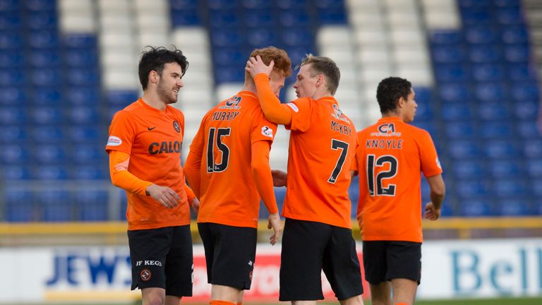 Dundee United's Simon Murray (15) celebrates with teammates after he scores his side's opener