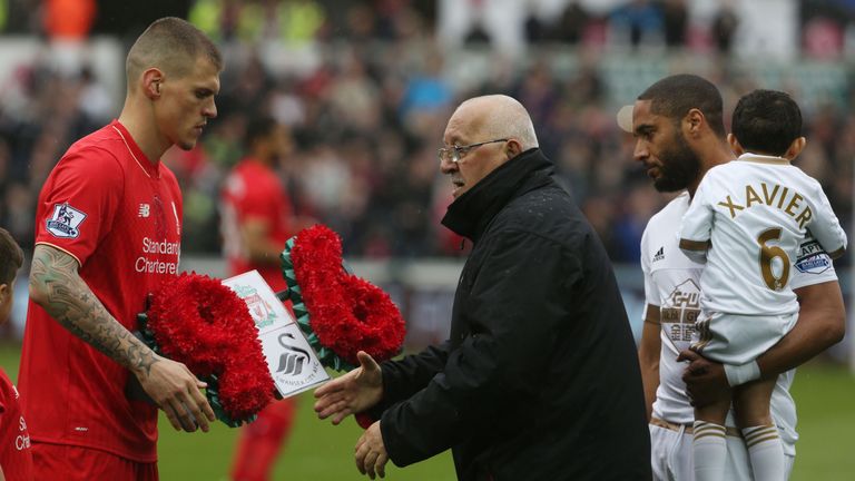 Martin Skrtel (left) presents a wreath in commemoration of the 96 Hillsborough victims to Brian Devonside