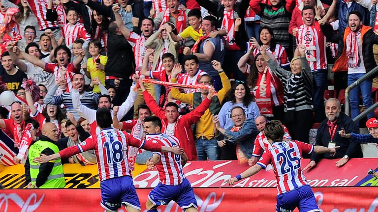 (L-R) Sporting Gijon's forward Ismael Lopez, midfielder Sergio Alvarez and Croatian forward Alen Halilovic celebrate a goal during the Spanish league footb