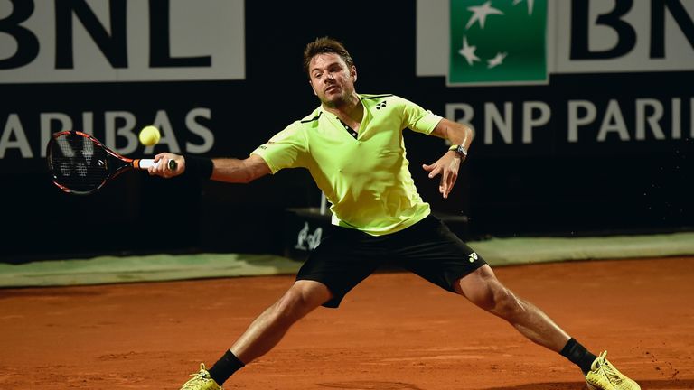 Stanislas Wawrinka plays a forehand in his match against Benoit Paire on Day Three of the Italian Open