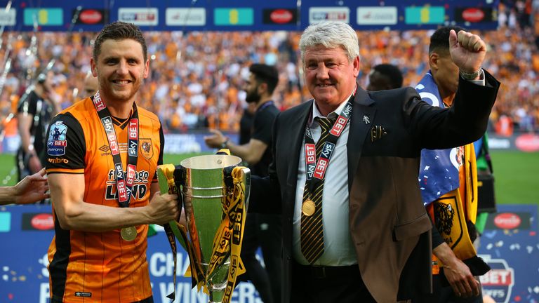 LONDON, ENGLAND - MAY 28:  Alex Bruce of Hull City and his father Steve Bruce, manager of Hull City celebrate with the trophy after the Sky Bet Championshi