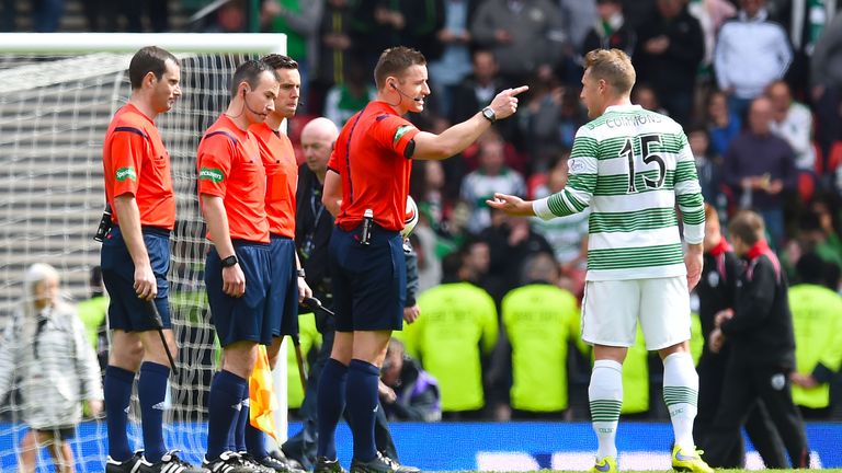 Steven McLean waves away protest from Kris Commons after failing to spot Josh Meekings' handball