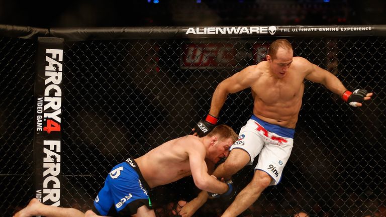 Junior dos Santos (R) eludes a hold from Stipe Miocic in their heavyweight bout during the UFC Fight Night event at the at U.S. 