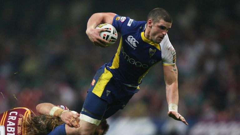  Stuart Reardon of Warrington is tackled by Eorl Crabtree of Huddersfield 