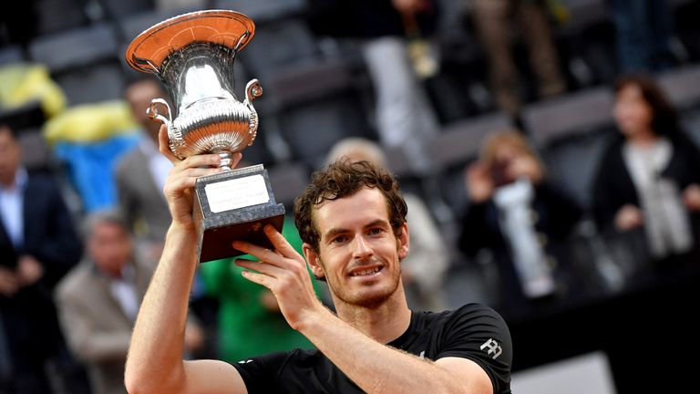 Britain's Andy Murray holds his trophy after winning the men's final match against Novak Djokovic