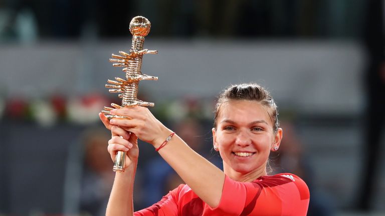 Simona Halep celebrates after her win over Dominika Cibulkova in the final of the Madrid Open
