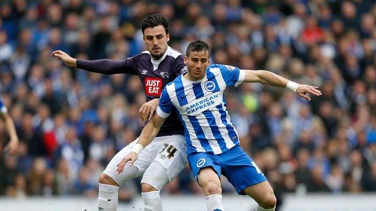 Brighton's Tomer Hemed (right) and Derby's George Thorne battle for the ball  
