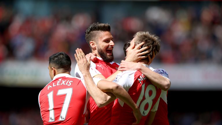 Arsenal's Olivier Giroud (centre) celebrates scoring their first goal of the game with team-mates v Aston Villa, Premier League