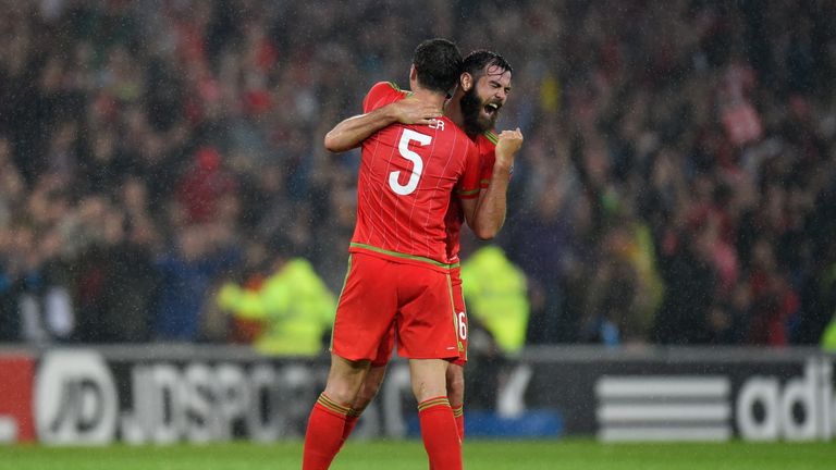 Wales players James Chester (l) and Joe Ledley celebrate 