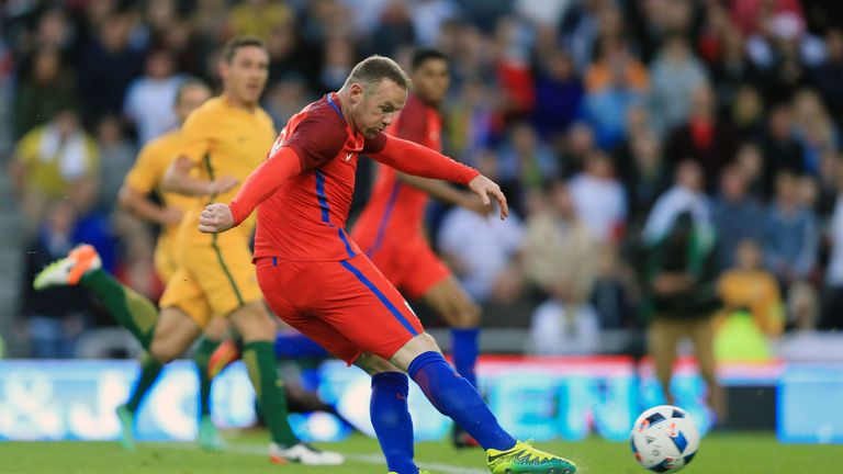 England's Wayne Rooney scores 