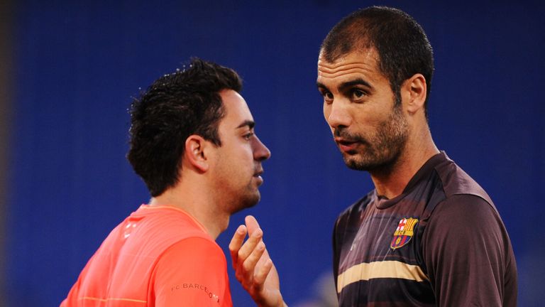 ROME - MAY 26:  Josep Guardiola coach of Barcelona speaks to Xavi during the Barcelona training session prior to UEFA Champions League Final versus Manches