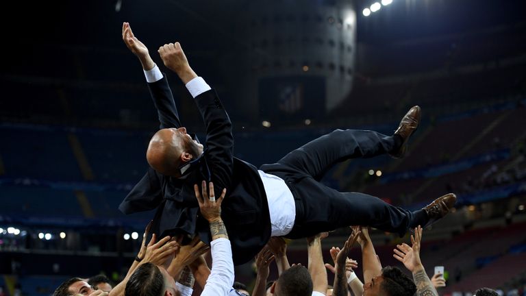 Real Madrid head coach Zinedine Zidane is thrown in the air by his jubilant players after Champions League final victory