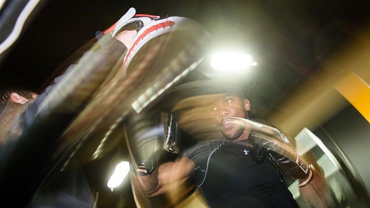 Anthony Joshua works out on the pads with Tony Sims