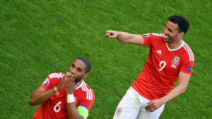 Wales' defender Ashley Williams (L) and Wales' forward Hal Robson-Kanu celebrate the team's 2-1 win over Slovakia in the Euro 2016 group B football match b
