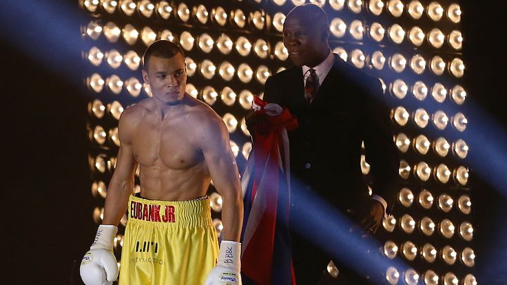 Chris Eubank Jr (L) approaches the ring with his father