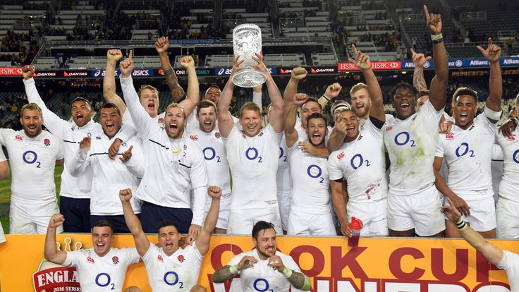 England's captain Dylan Hartley (C) lifts the Cook Cup trophy